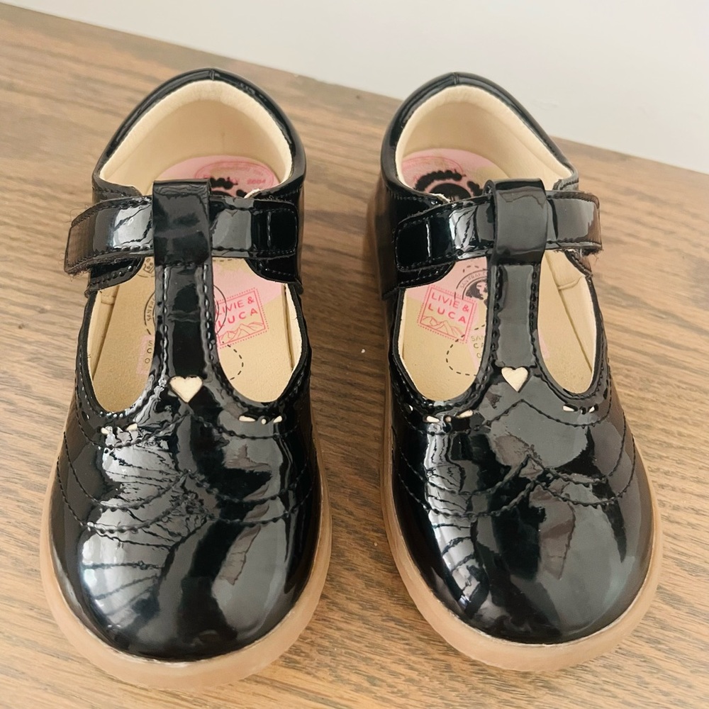 Adorable. Classic. Classy. Comfortable black Patent leather shoe.
